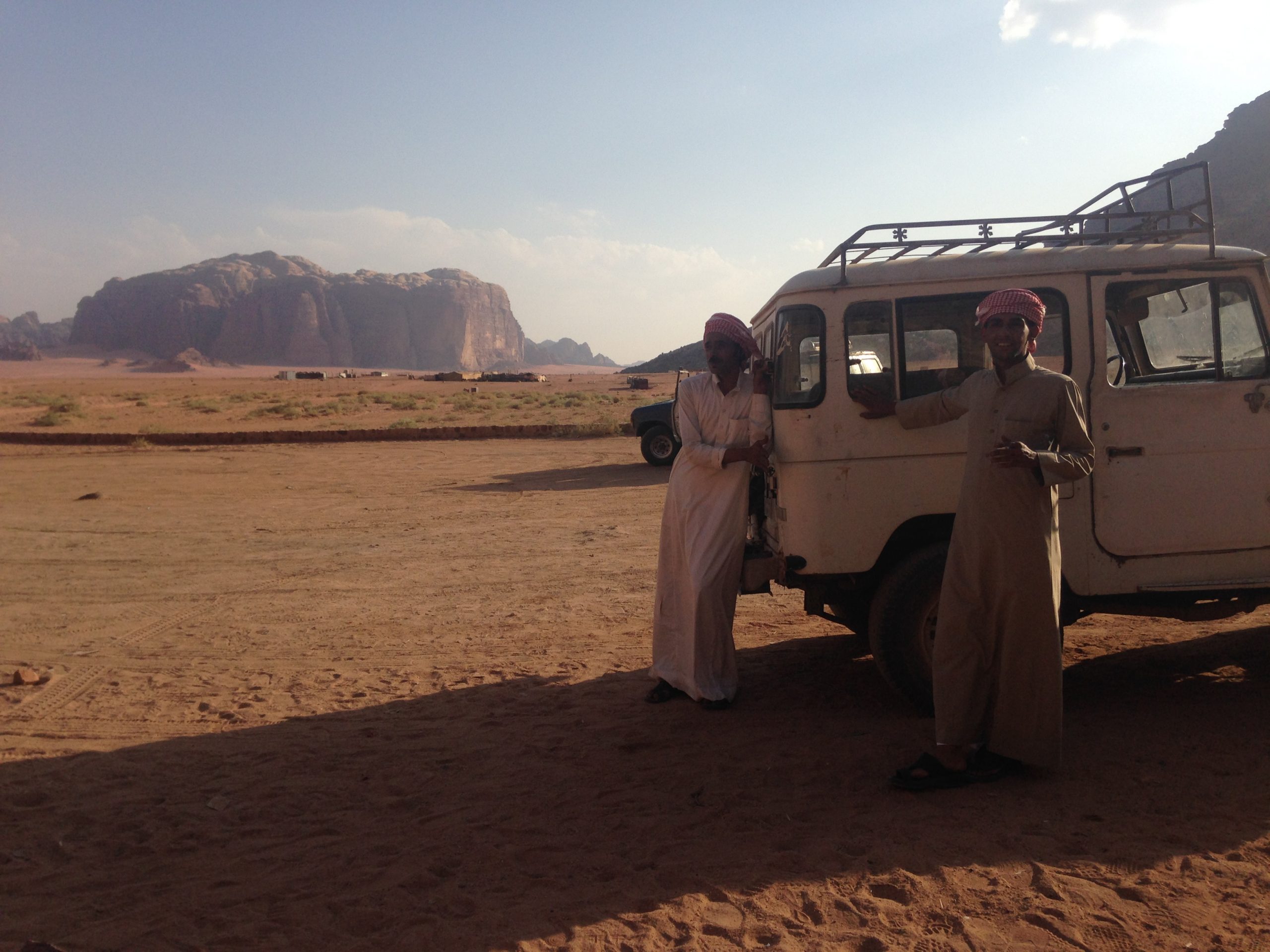 Two Bedouins wearing traditional Bedouin clothes in the Wadi Rum desert. Photo by Camilla Toftlund.